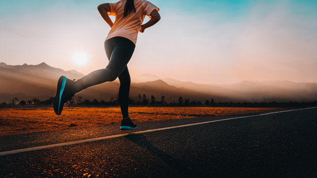 woman running down a road
