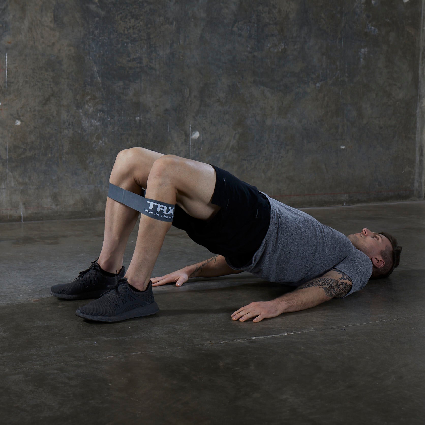 bridge pose with trx exercise bands