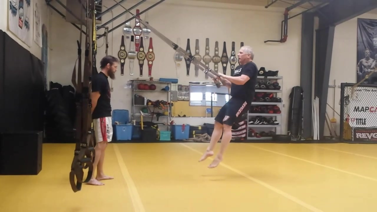 Glenn Beach performs a jump squat with the TRX Suspension Trainer