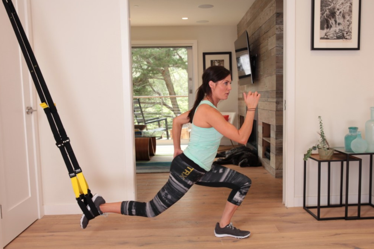 Lifter performing a TRX Suspension Trainer row as part of a 5 day workout split for full body strength training.