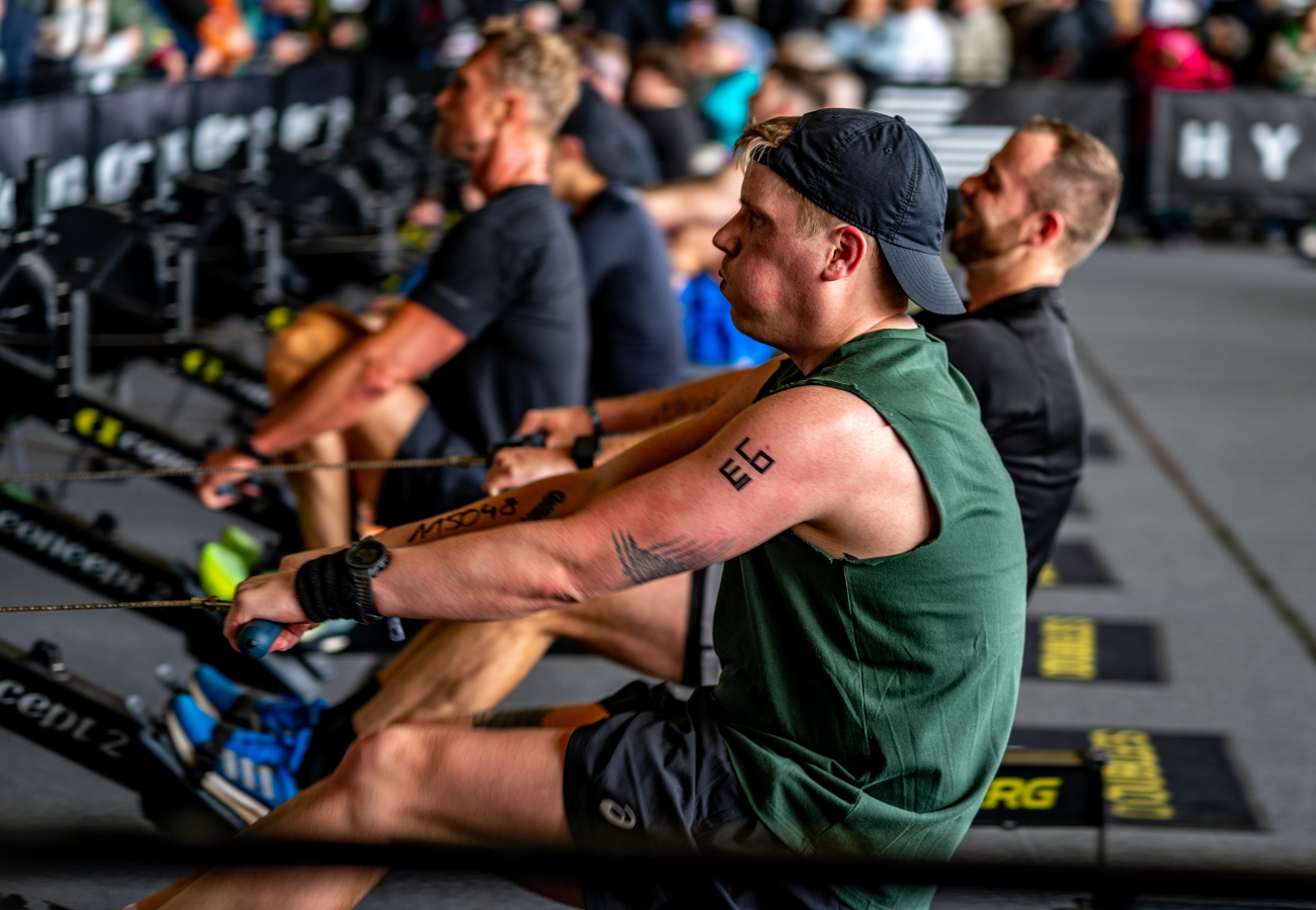 Fitness competitors racing through functional training stations as HYROX alternatives