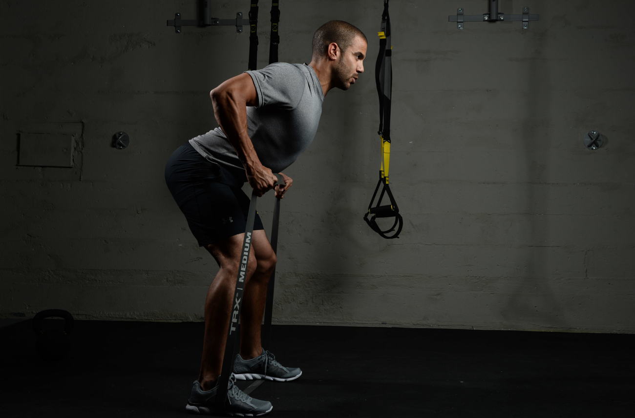 man doing chest exercise with band