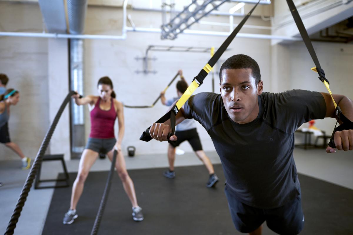 man doing trx exercises for lacrosse