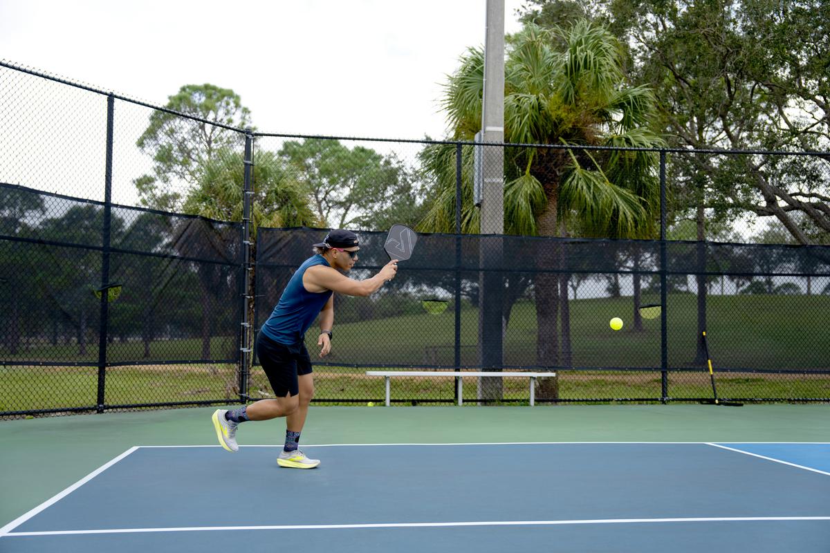 mature man playing pickleball