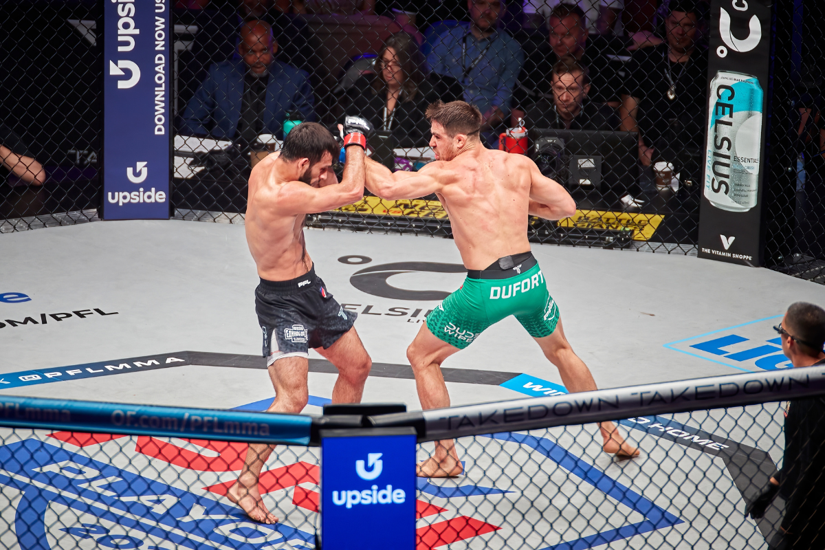 MMA fighter demonstrating striking technique in a training gym