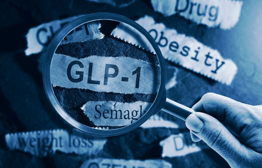 magnifying glass on slip of paper saying glp-1
