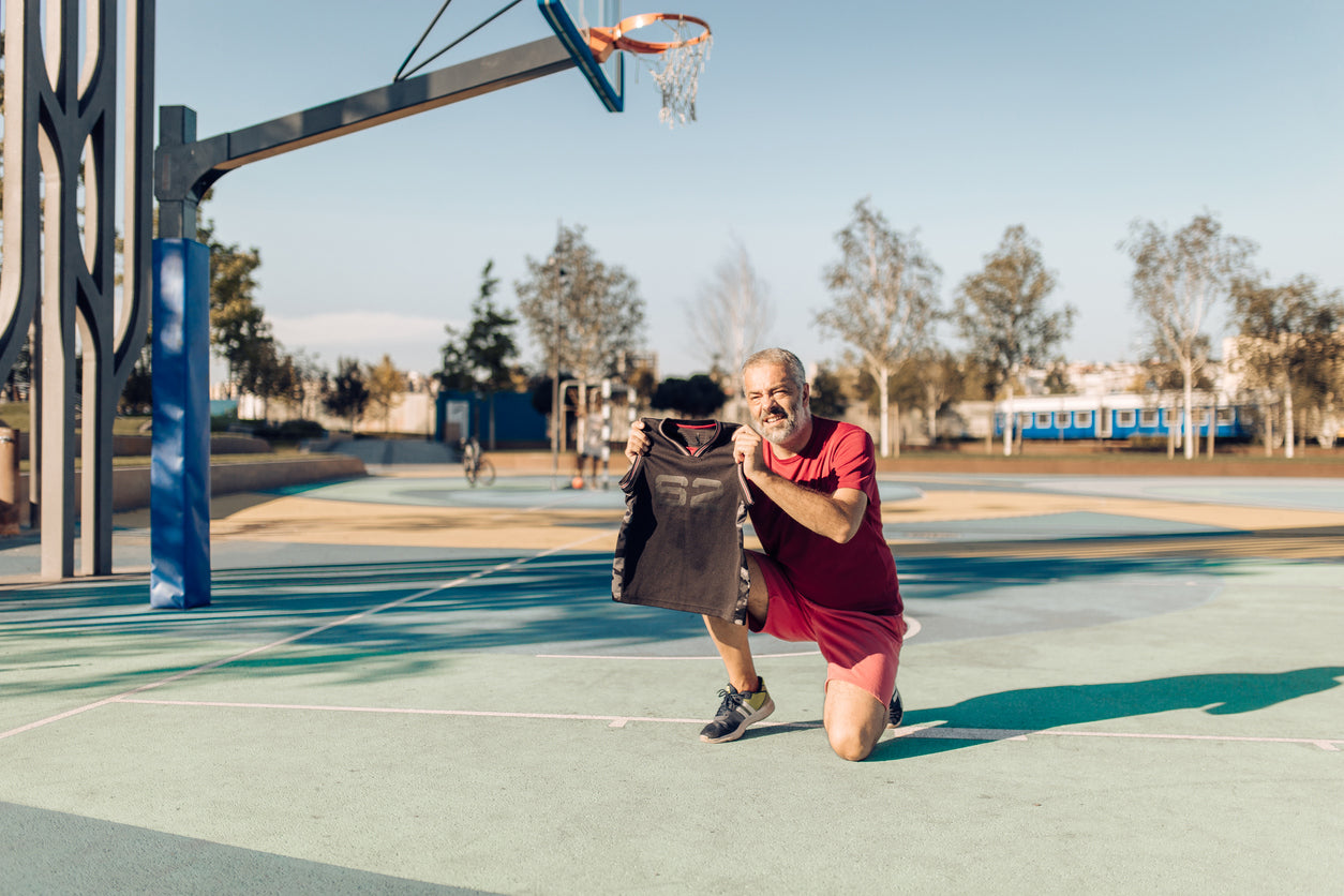 player holding basketball gift jersey