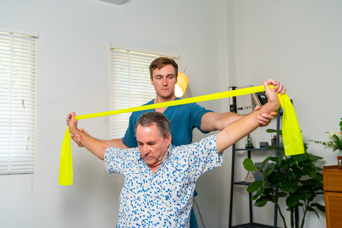Person performing shoulder stretches at home with TRX suspension trainer