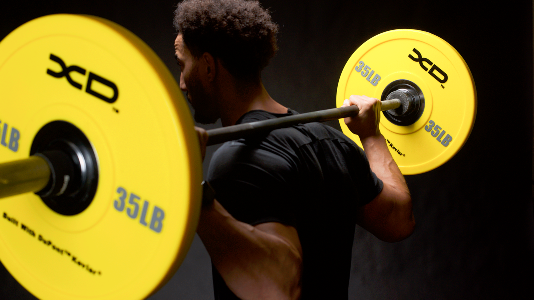 trainer attempting squat pr
