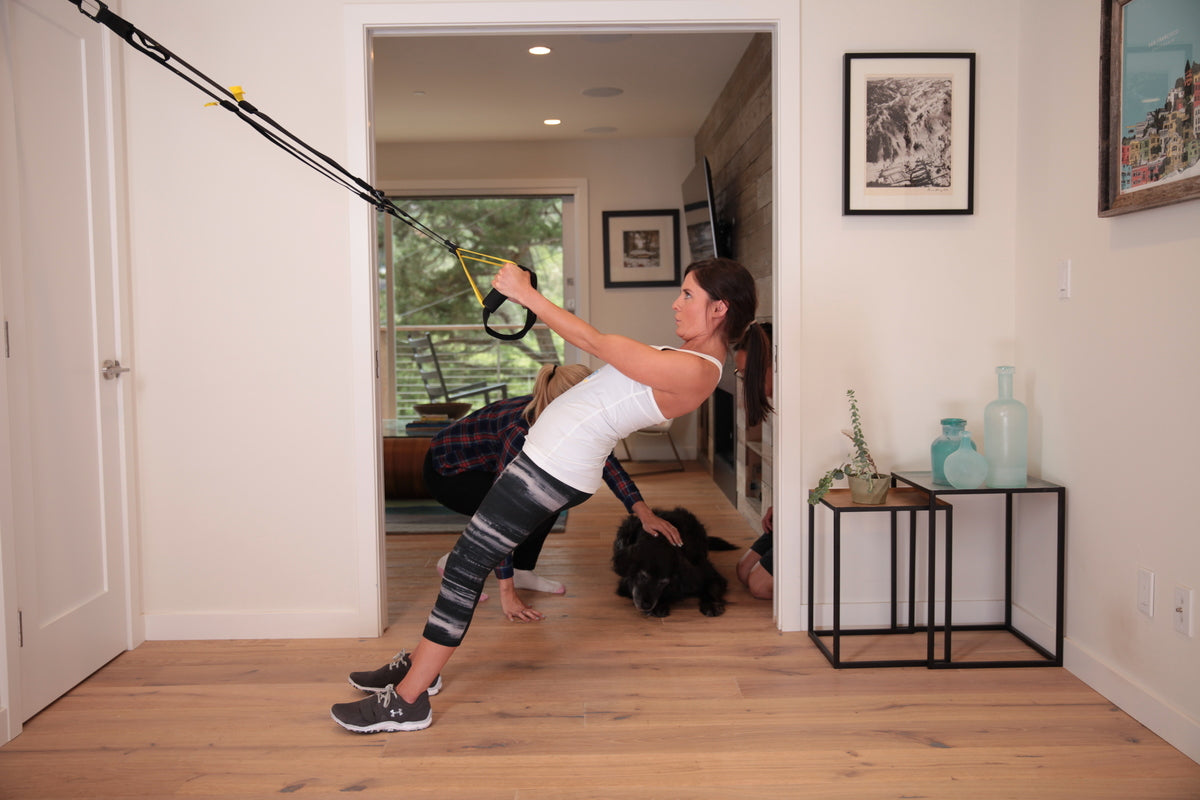woman exercising in home gym