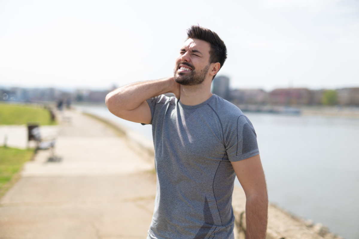 Person safely working out after injury using TRX suspension training for gradual recovery